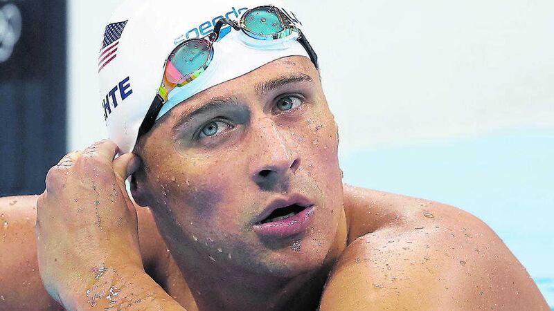 Ryan Lochte claimed that he and three other American swimmers were robbed at gunpoint in Rio (AP Photo/Michael Sohn, File).