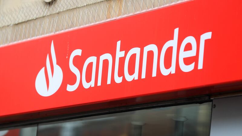 Santander UK has notched up a rise in annual profits after being boosted by higher interest rates, but flagged rising numbers of borrowers falling behind with repayments