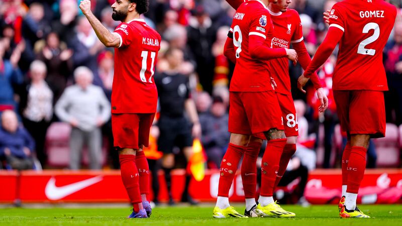 Liverpool’s Mohamed Salah celebrates his winner .