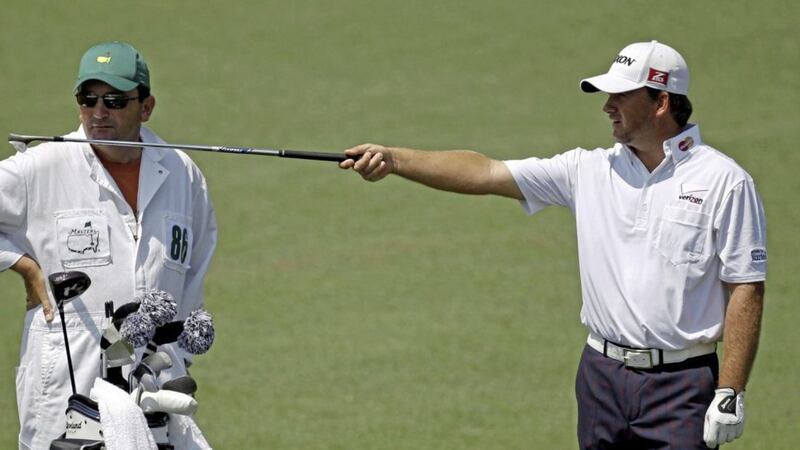 Graeme McDowell with his caddie Ken Comboy, who has tested positive for coronavirus. Picture by AP Photo/Chris O&#39;Meara 