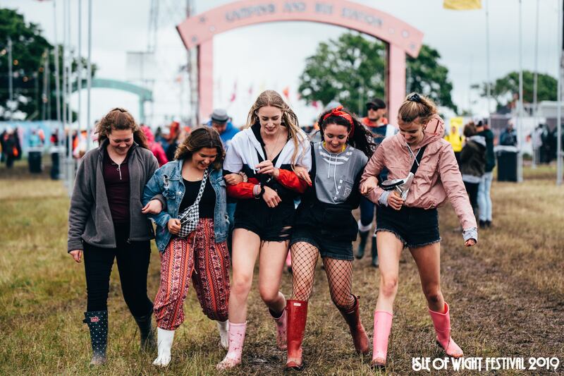 Festival-goers braving the mud on Thursday