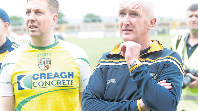 Antrim minor manager Ciaran Kearney (left) and his senior counterpart Dominic McKinley after both sides won their respective Ulster finals at Owenbeg earlier this month<br />Picture by Colm O&rsquo;Reilly