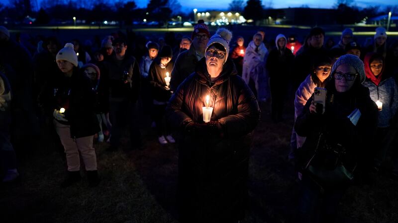 A candlelight vigil was held following a shooting at Perry High School in Iowa (AP)