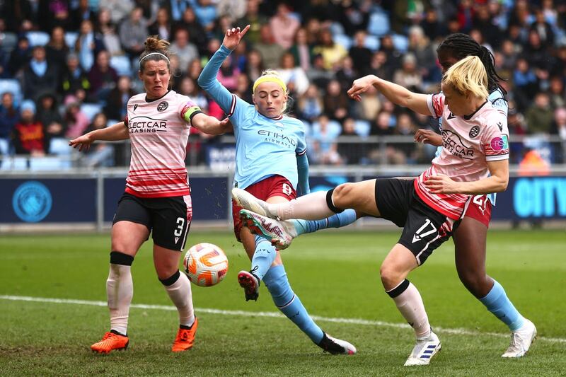 Chloe Kelly (centre) in action for Manchester City (Tim Markland/PA)