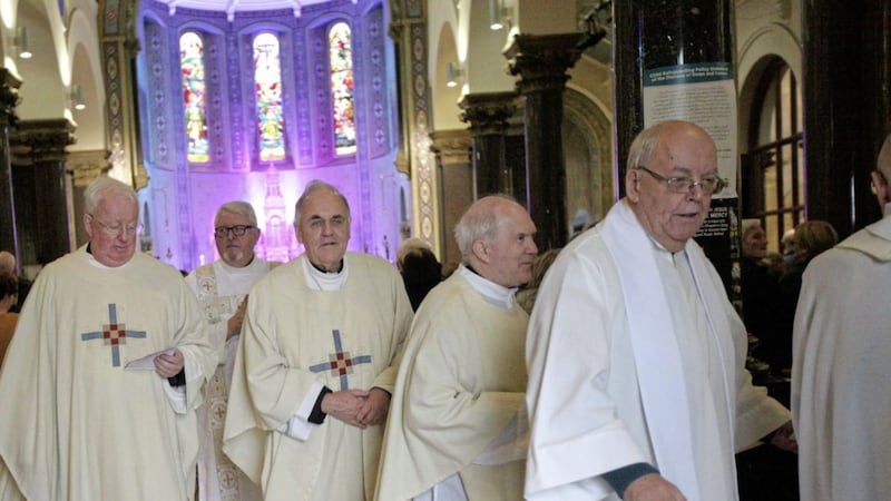 Fr Aidan Troy, centre, and Fr Charles Cross, left, were among the priests at a mass to celebrate 150 years of the Passionists at Holy Cross in Ardoyne. Picture by AnnMcManus 