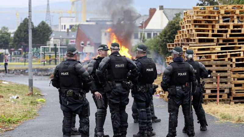 Police presence at the Bloomfield Walkway bonfire after it was set alight prematurely as contractors were about to remove it. Picture Mal McCann. 