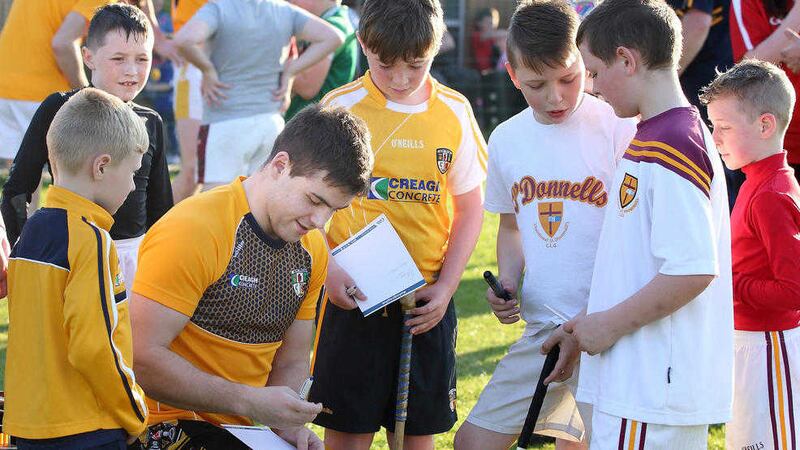 Antrim's Patrick McBride signs autographs for young fans earlier this week<br /> Picture by Cliff Donaldson