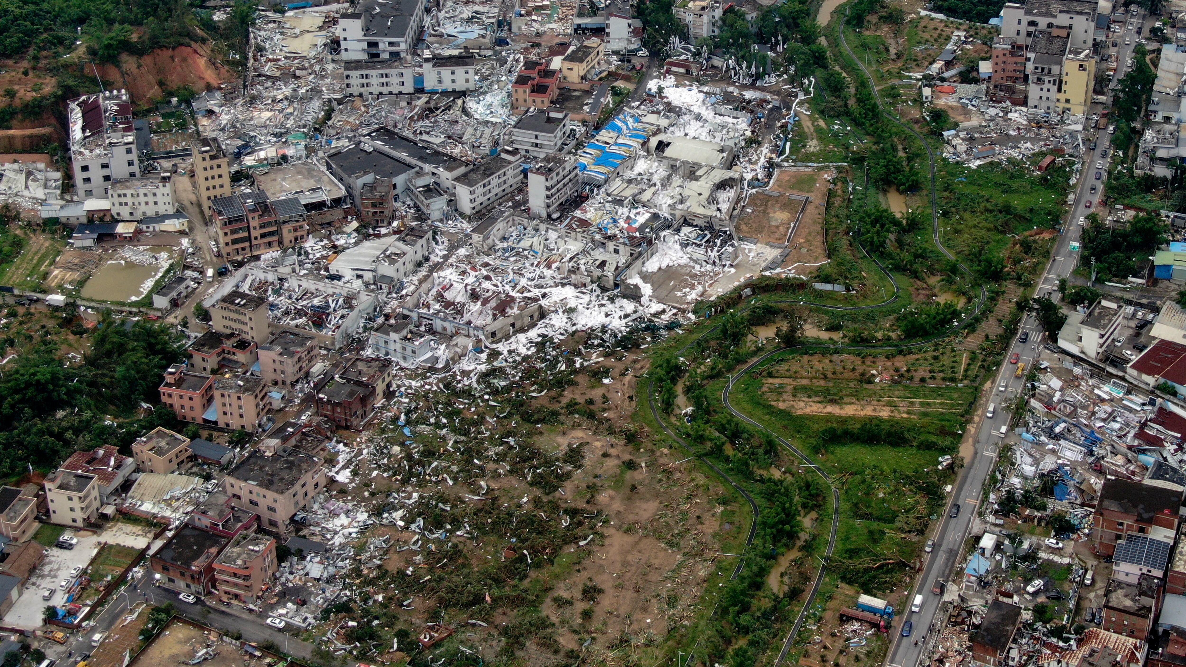 An aerial view shows damaged buildings in the aftermath of a tornado in Guangming village, Guangzhou (Deng Hua/Xinhua/AP)