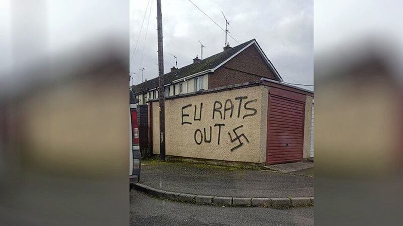 Police believe graffiti daubed in Banbridge is linked to an attack on a Bulgarian family&#39;s car in the town. Picture by PSNI Banbridge 