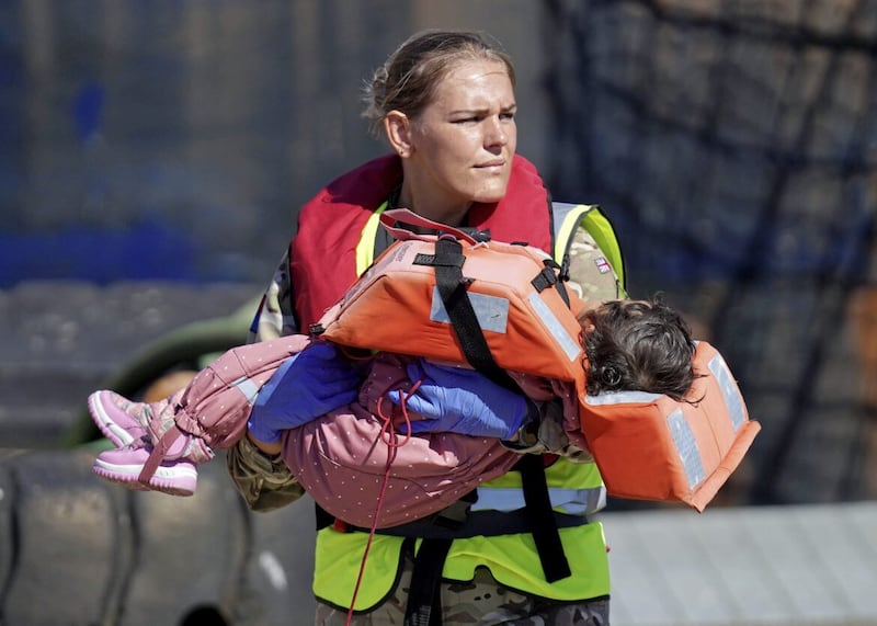 A young refugee is rescued following a &#39;small boat&#39; incident in the English Channel. Picture by Gareth Fuller/PA Wire. 