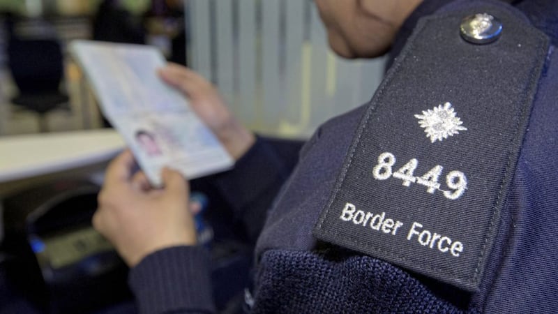 A Border Force officer checking passports, as ending freedom of movement will only have a &quot;marginal&quot; impact on migration to the UK, according to a new think tank 