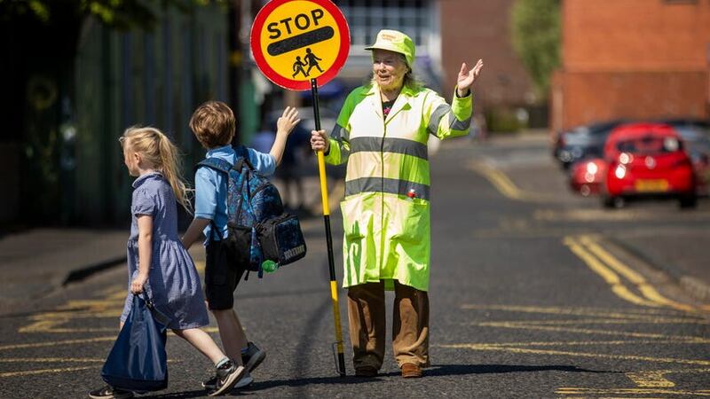 Lollipop lady Veronica Hammersley, 93, who works on the school crossing patrol at Glengormley Integrated Primary School in Northern Ireland, has been awarded the BEM (Liam McBurney/PA)
