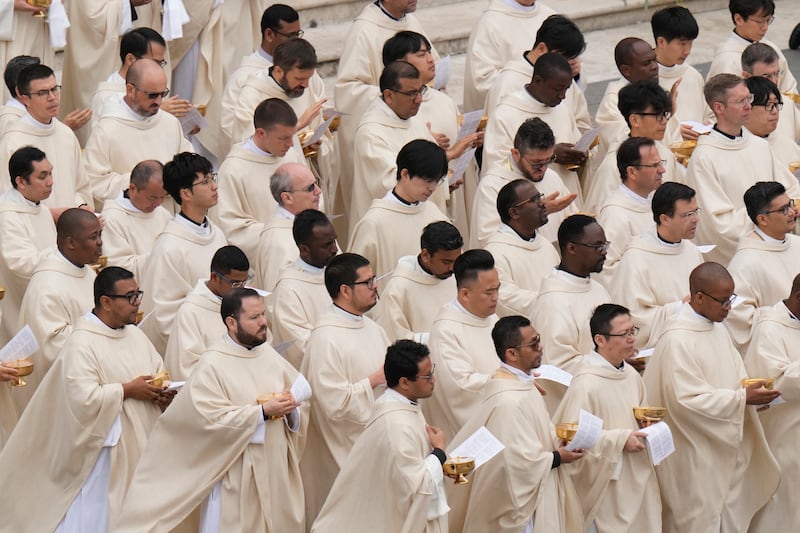 Priests stand during Easter mass in St Peter’s Square celebrated by Pope Francis, at the Vatican (Alessandra Tarintino/AP)