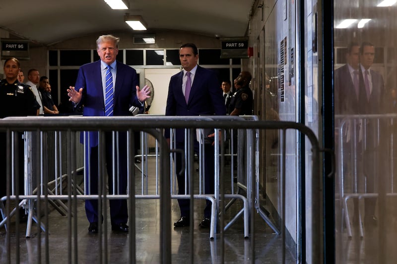 Donald Trump speaks to the media as he arrives at Manhattan Criminal Court (Michael M Santiago/Pool Photo via AP)