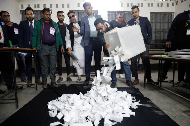 Officials prepare to count votes of the parliamentary election in Dhaka, Bangladesh (Mahmud Hossain Opu, AP)