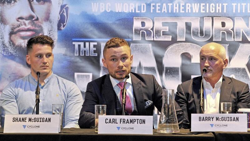 Carl Frampton (middle) with former trainer Shane McGuigan (left) and ex-manager Barry McGuigan (right) in June. Picture by Alan Lewis, Photopress 