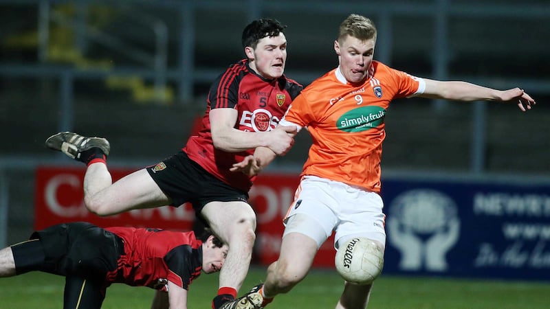 Down's Jamie Donnan fails to stop Armagh's Oisin O'Neill<br />Picture by Press Eye&nbsp;