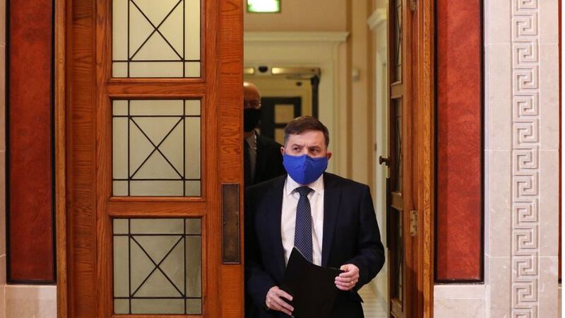 &nbsp;Health Minister Robin Swann (front) and the chief scientific adviser Professor Ian Young arrive for a press conference in Parliament Building, Stormont, to discuss the latest coronavirus situation.