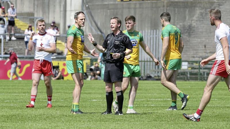Donegal Michael Murphy debates a decision with referee Joe McQuillan during the Ulster Senior Football Championship semi-final match at Brewster Park. Picture Margaret McLaughlin 