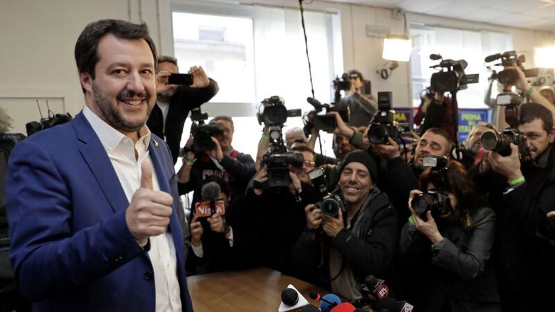 The League&#39;s Matteo Salvini gives the thumbs up as he arrives to give a press conference on the preliminary election results in Italy. In an upset, the results showed the right-wing, anti-immigrant and euroskeptic League party of Salvini surpassing the long-time anchor of the center-right, the Forza Italia party of ex-Premier Silvio Berlusconi 
