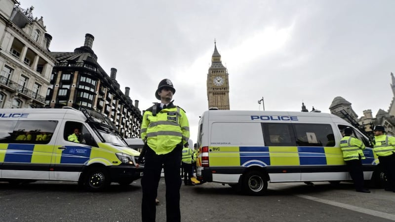 Police outside Westminster during a vigil a week after the Westminster Bridge terror attack 