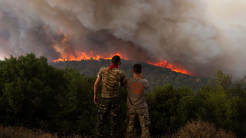 More than 600 firefighters, including reinforcements from several European countries, backed by a fleet of water-dropping planes and helicopters are battling three persistent major wildfires in Greece (Achilleas Chiras/AP)