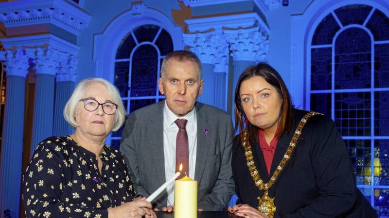 David Sterling, interim head of the Northern Ireland Civil Service, Joan Salter, whose family were displaced as a result of the Holocaust and Belfast lord mayor Deirdre Hargey at the Holocaust memorial event in Belfast City Hall