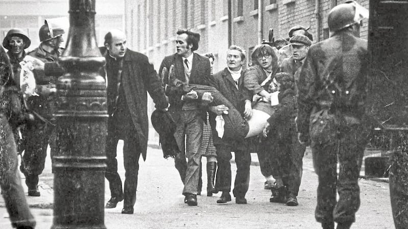 Fr Edward Daly and others try to get medical aid Jackie Duddy 