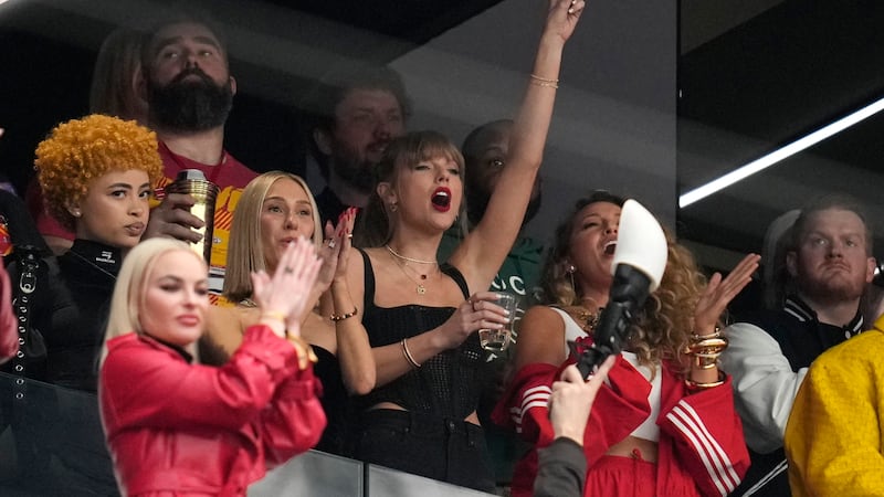 Taylor Swift embraces her boyfriend Kansas City Chiefs tight end Travis Kelce (Abbie Parr/AP)