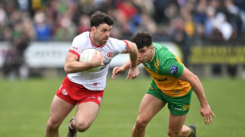 Darren McCurry takes on Odhran McFadden-Ferry. Picture: Oliver McVeigh