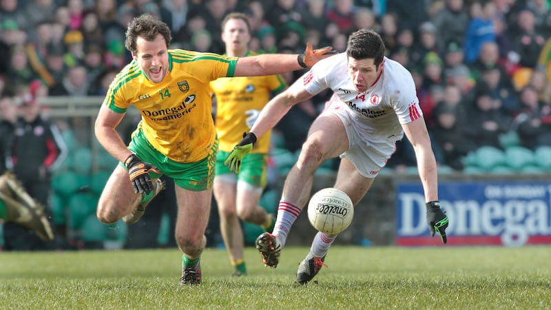 Sean Cavanagh and Michael Murphy battle for a ball in this year's League clash. Sunday's game could be decided by a moment of quality from either player