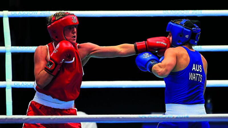 Alanna Audley-Murphy (red) in action against Australia's Shelley Watts during the 2014 Commonwealth Games in Glasgow