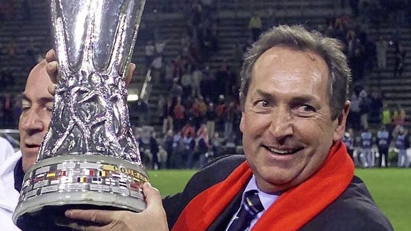 Liverpool manager Gerard Houllier holds aloft the Uefa Cup in 2001.