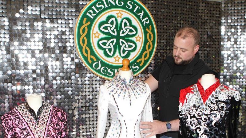 Keith Marron puts finishing touches to one of his Irish dancing dresses. Picture by Matt Bohill. 
