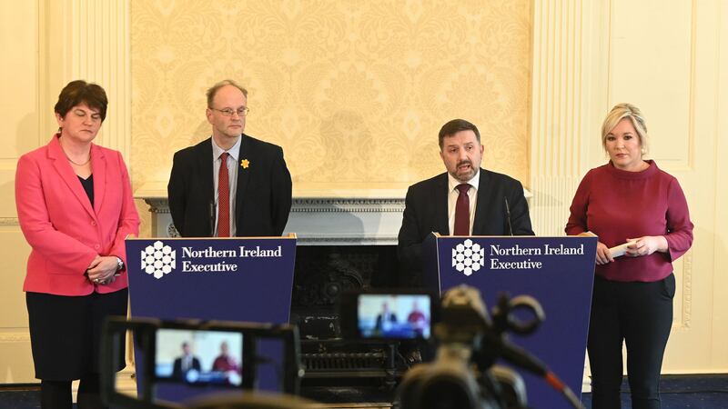 First Minister Arlene Foster (left) and Deputy First Minister Michelle O&Otilde;Neill (right) with Health Minister Robin Swann (centre right) and Education Minister Peter Weir (centre left) give a Covid 19 update to the media at Stormont yesterday. Picture by PA Wire&nbsp;
