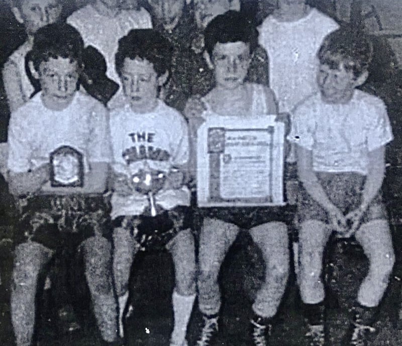 An 11-year-old Hugh Russell, second from left, with the Simon Donnelly perpetual trophy he was awarded for his best boxer performance 