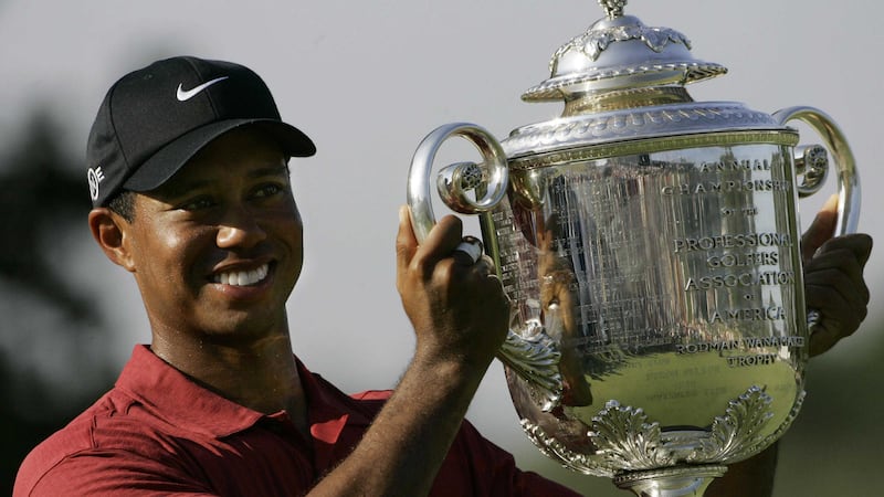 <span style="font-family: Arial, Verdana, sans-serif; ">Tiger Woods holds up the Wanamaker Trophy after winning the 89th PGA Golf Championship at the Southern Hills Country Club in Oklahoma</span>