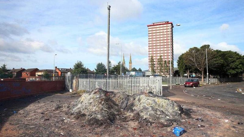 The remnants of the bonfire near Divis flats in west Belfast. Picture Mal McCann 