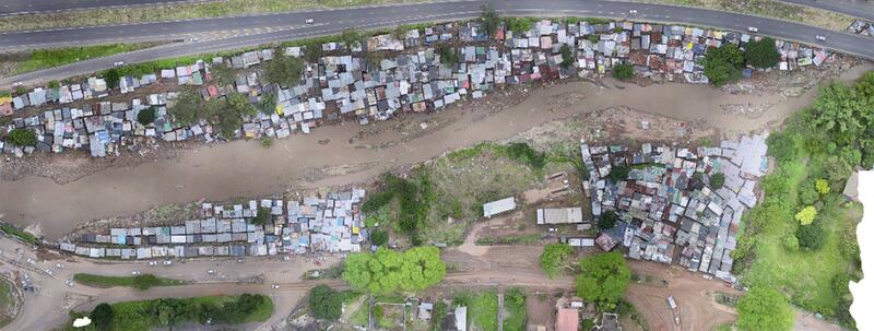 Drone image of Quarry Road Informal Settlement located on a narrow flood plain of the Palmiet River, a high-risk area prone to flooding, after heavy rainfall, 13 April 2022. Photo: Dr. Viloshin Govendet, Architect and Lecturer for the School of Built Environment and Development Studies at the University of KwaZulu-Natal