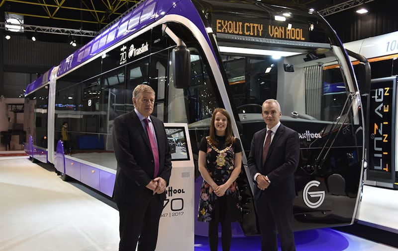 (left to right) Ciar&aacute;n de B&uacute;rca, Director of Transport Projects, Department for Infrastructure, Nuala McAllister, Lord Mayor of Belfast and Chris Conway, Group Chief Executive, Translink unveil the new Belfast Rapid Transit Glider vehicle at Bus World in Belgium&nbsp;