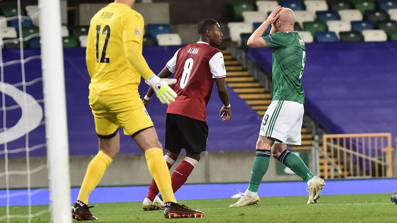 Northern Ireland's Liam Boyce holds his head after narrowly failing to net a late leveller against Austria in the Nations League.&nbsp;