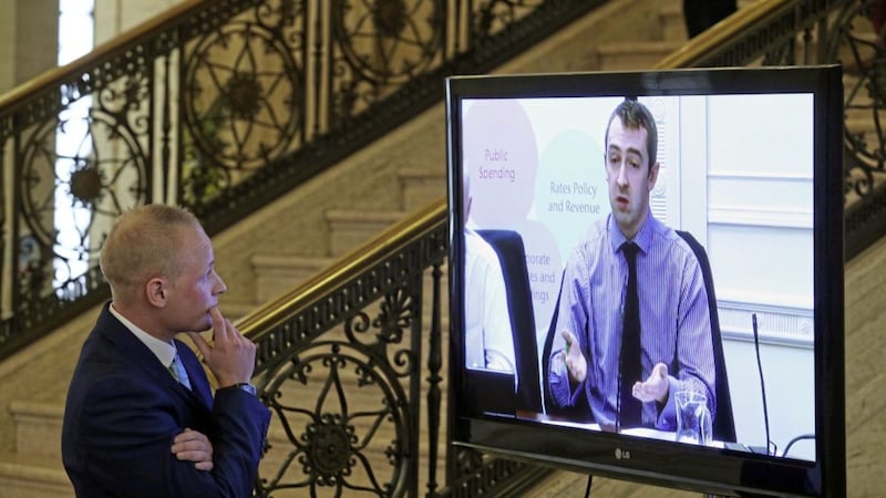 Jamie Bryson watches Sinn Fein MLA Daithi&shy; McKay on a tv screen in the Great Hall in Stormont before he appeared at the finance committee&#39;s Nama inquiry in September 2015. Picture by Mal McCann 