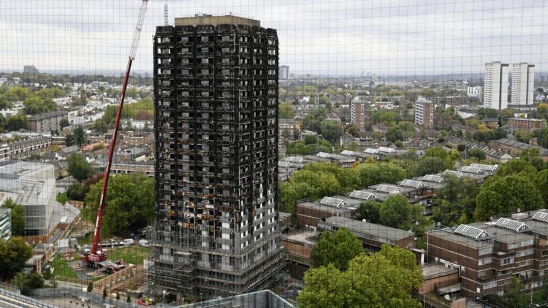 Grenfell Tower pictured last month as work commenced to cover the building, nearly four months since a fire inflicted the most costly tragedy in recent British history. Picture by Victoria Jones, Press Association