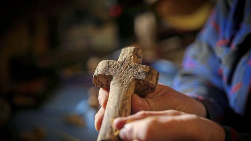 Belfast author Jim Deeds has been making crosses from reclaimed wood during the Covid-19 pandemic. His latest book, A Look of Love - Witnesses to Jesus, includes a story about the man who made the cross on which Jesus was crucified. Picture by Mal McCann 