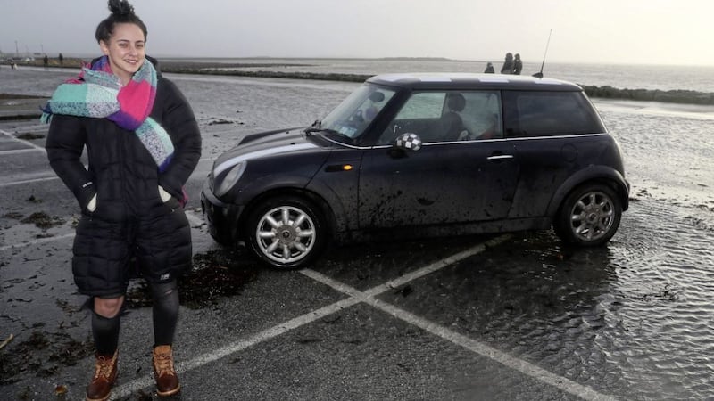 Selina Callaghan, from Donegal, at the car park on Salthill Promenade in Galway which she was parked in when Storm Eleanor hit, leaving her to drive to safety through waves crashing onto the road. Picture by Brian Lawless/PA 