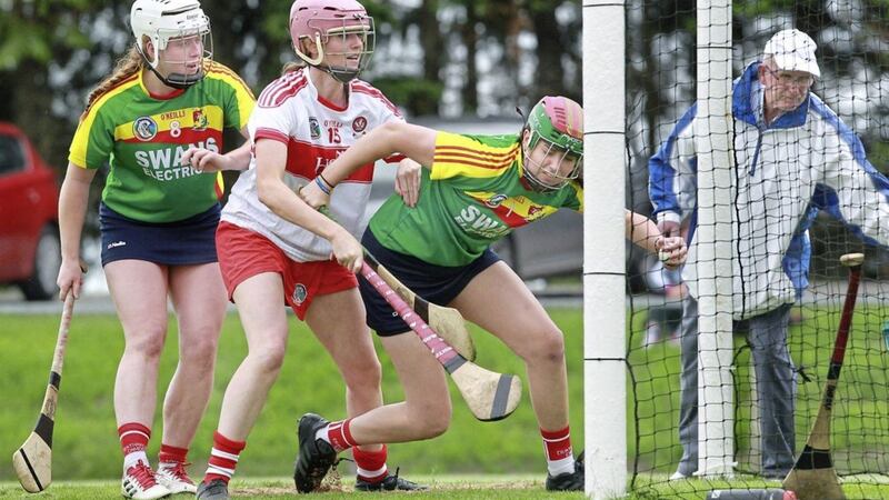 Derry Grainne McGoldrick battles in the goal mouth with Carlow keeper Kate Kinsella and Michelle Nolan at Swatragh on August 4 2018. Picture by Margaret McLaughlin. 