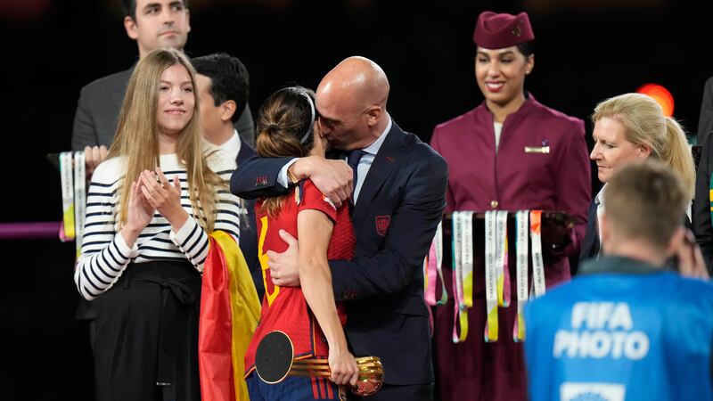 Luis Rubiales, right, hugs Spain’s Aitana Bonmati on the podium following Spain’s win (AP)