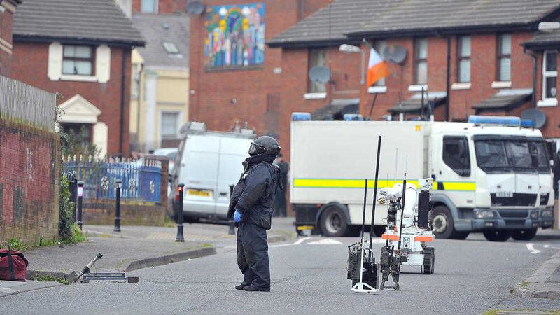 Army bomb disposal experts examine the scene at Sheridan Street in the New Lodge area of north Belfast 