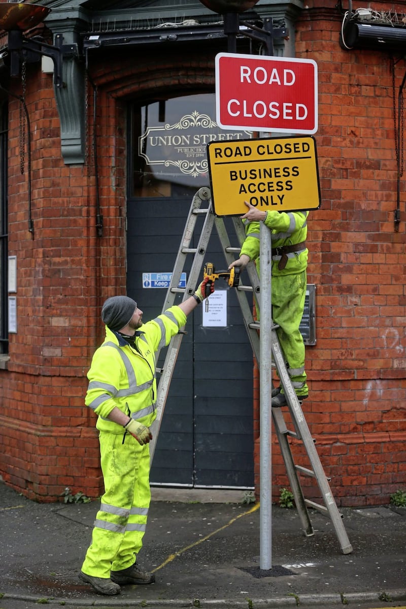SIgnage being erected for the pedestrianisation of Union Street in Belfast City Cerntre Picture Mal McCann. 