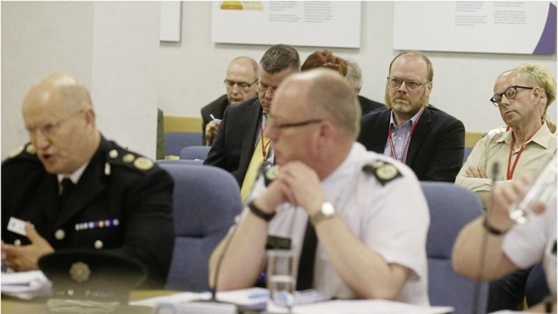 Durham chief constable Michael Barton and PSNI chief constable George Hamilton appear before the policing Board Picture on Thursday as journalists Trevor Birney and Barry McCaffrey look on Picture by Hugh Russell 